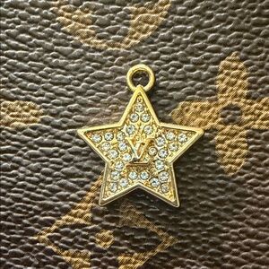 Eye catching Upcycled Louis Vuitton rhinestone star charm